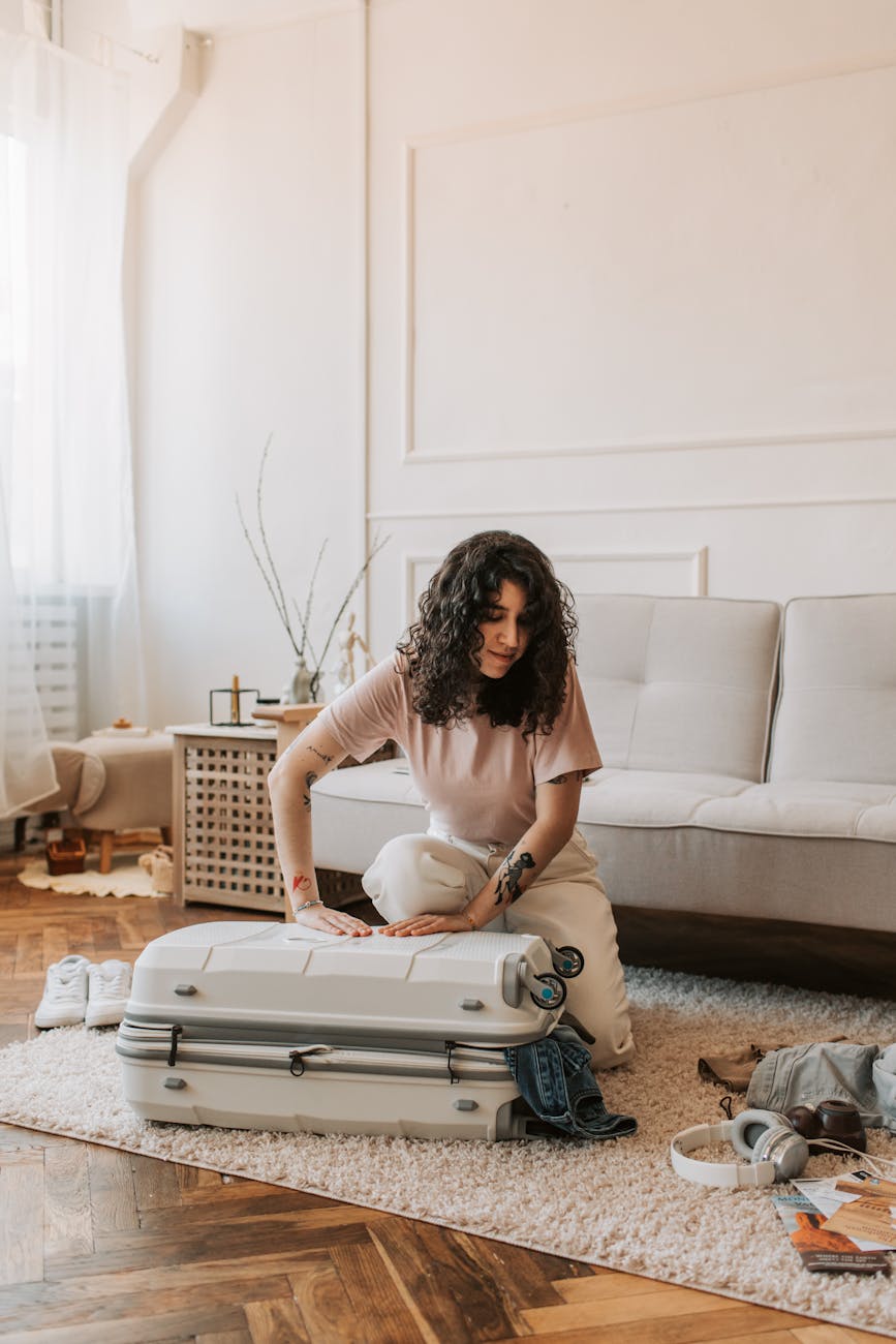 a woman packing her luggage